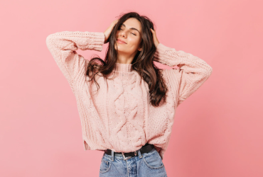 Woman wearing a pink color sweater