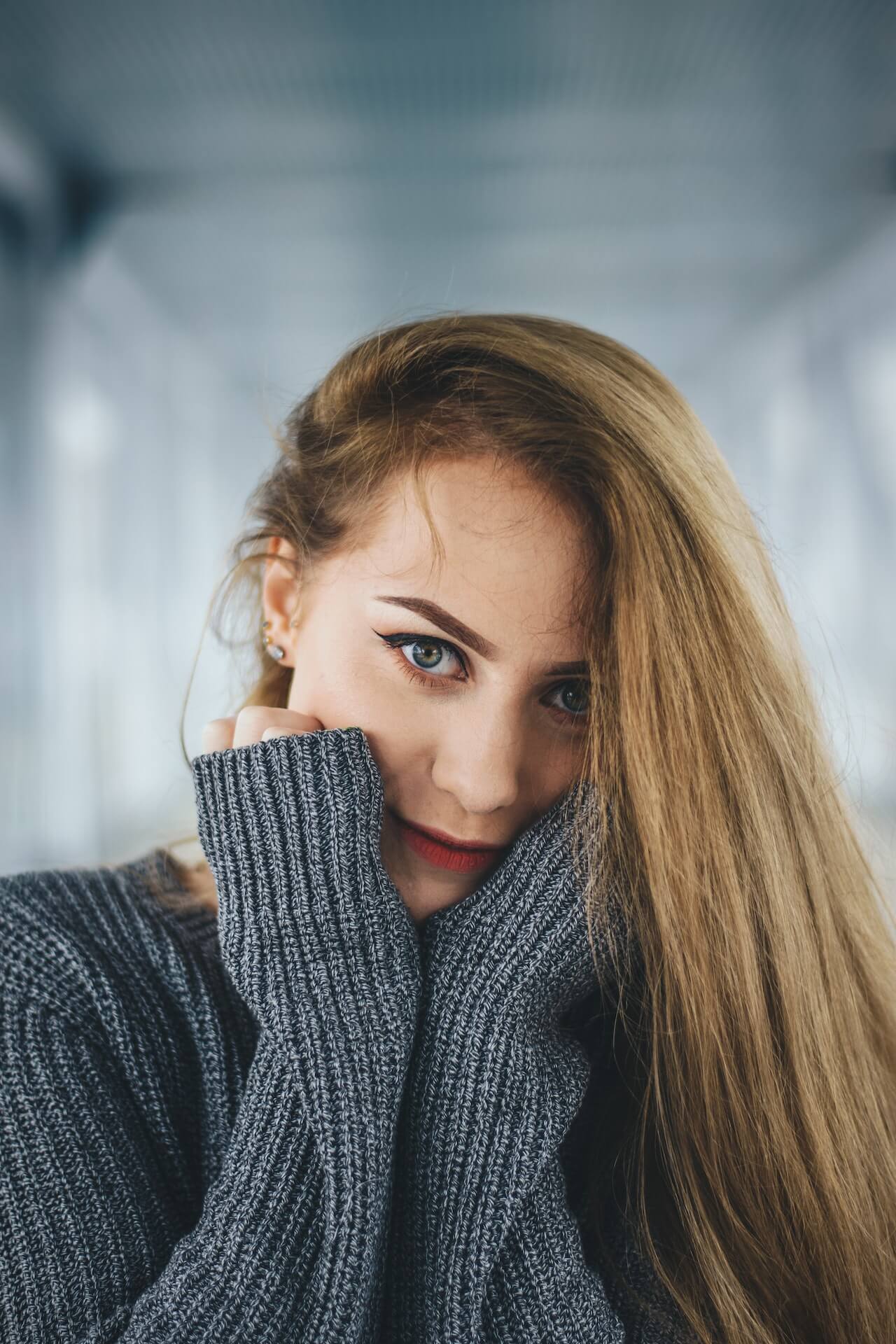 Woman wearing a mint color sweater